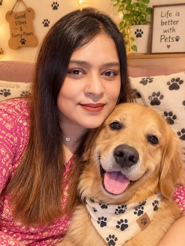 Renjita with a golden retriever